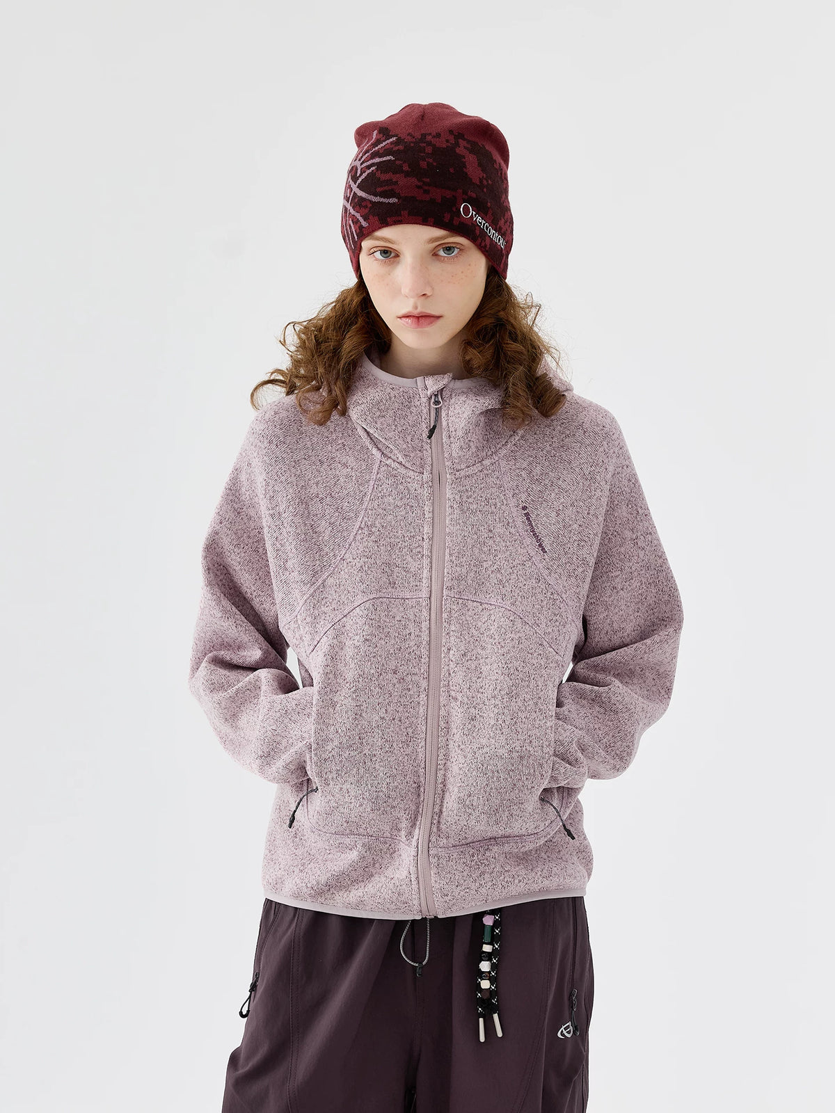 Model wearing pink full-zip melange knit fleece jacket, front view