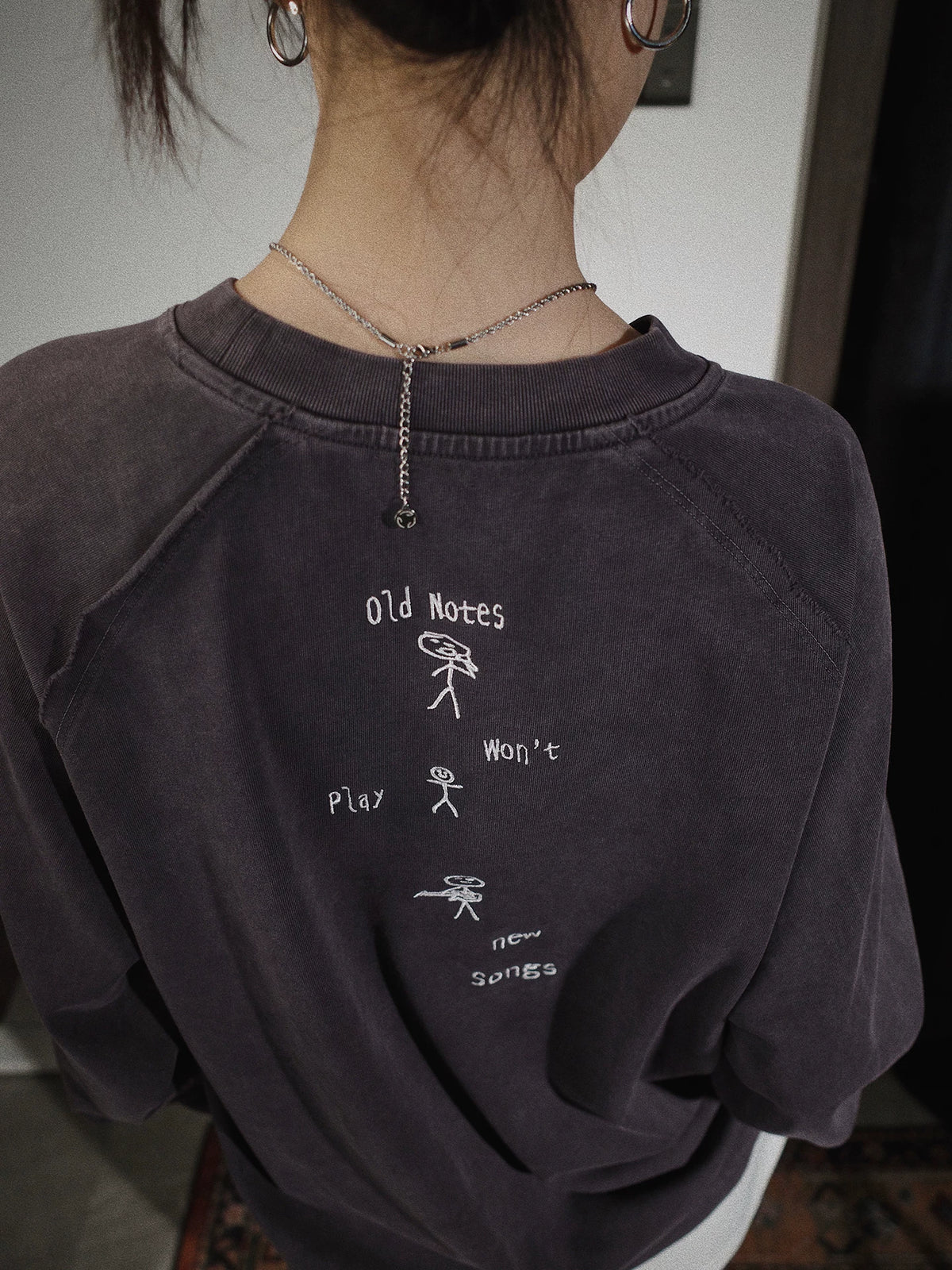 Old notes embroidered vintage band t-shirt, on model