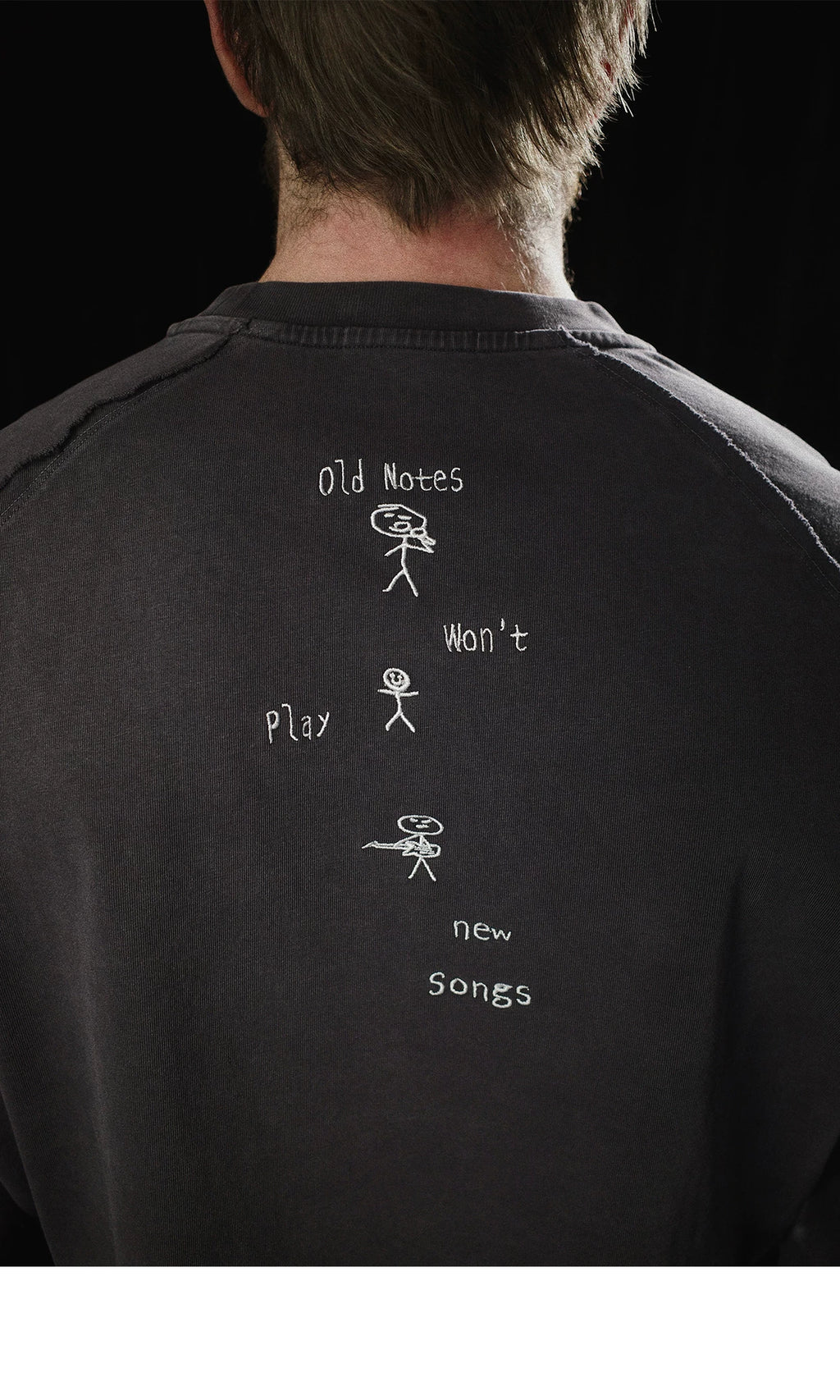 Old notes embroidered vintage band t-shirt, side view