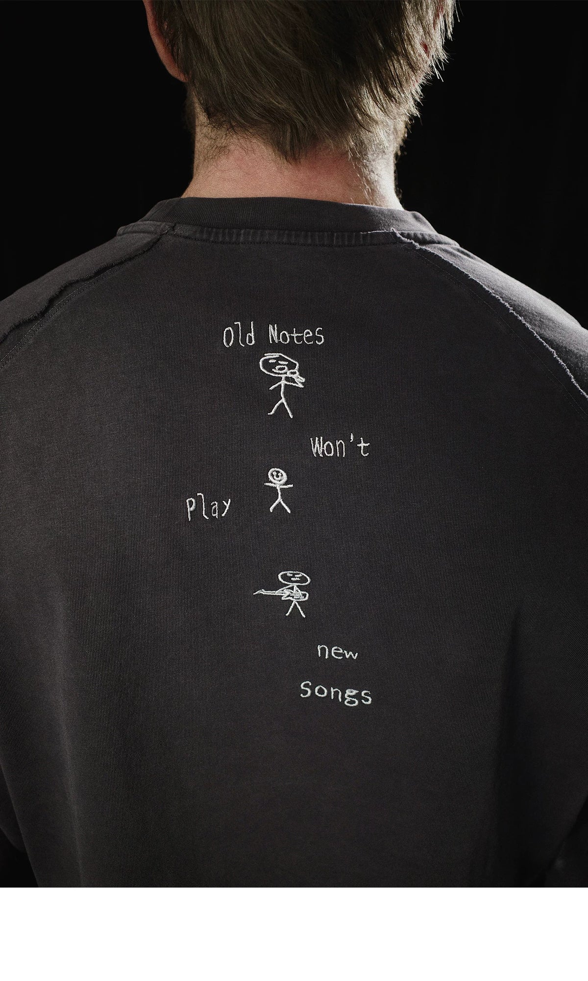 Old notes embroidered vintage band t-shirt, side view