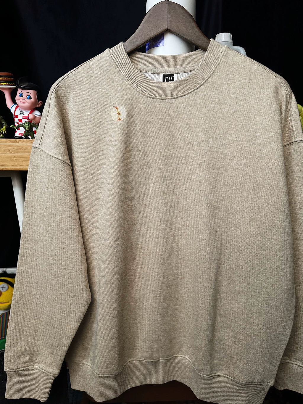 Pixel apple embroidered hoodie, flat lay