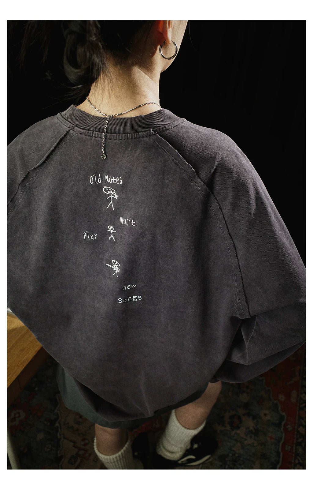 Old notes embroidered vintage band t-shirt, texture detail