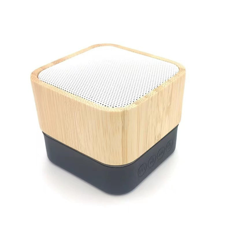Natural bamboo Bluetooth speaker on wooden table