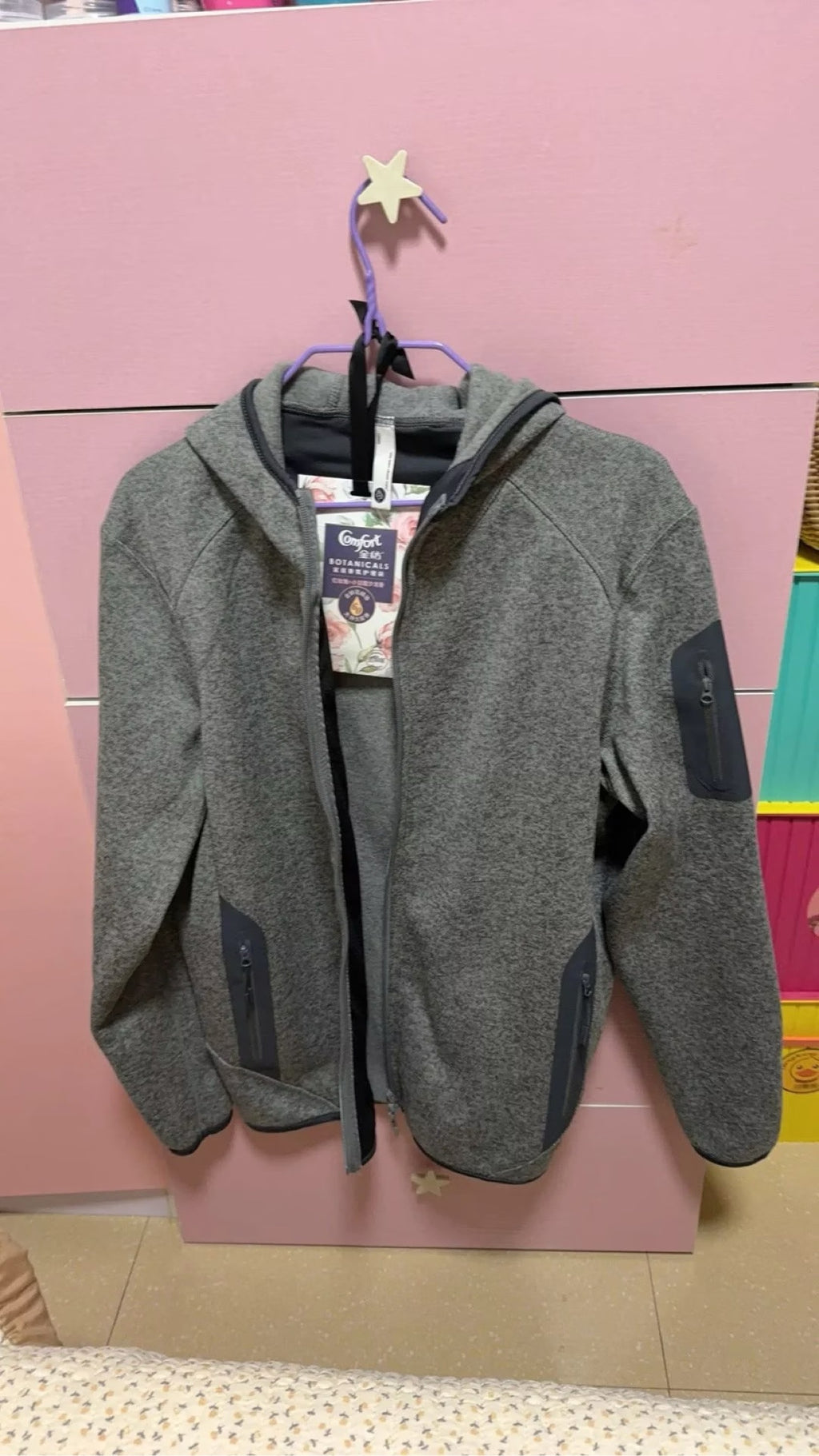 Couple fleece hoodie - front view on hanger